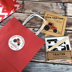 Red tractor party bag with tractor party favours and no plastic.