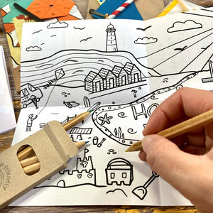 Activity book colouring sheet with colouring pencils from the holiday travel pack for kids