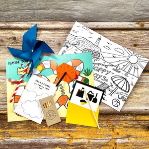 Seaside holiday travel pack for children full of crafts and games to keep them occupied on a journey or in the school holidays