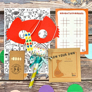 woodland plastic free party bag contains woodland mask, colouring sheet, crayons, seed pack, party blower and A6 activity card