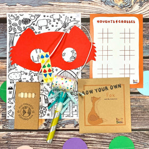 woodland plastic free party bag contains woodland mask, colouring sheet, crayons, seed pack, party blower and A6 activity card