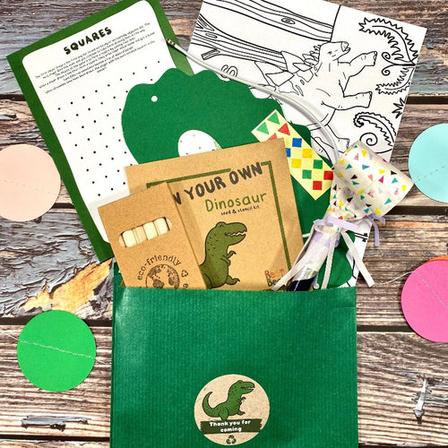 Dinosaur paper party bags filled with eco friendly crafts