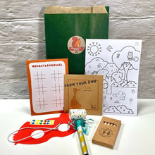 Load image into Gallery viewer, woodland themed filled paper party bag with eco friendly crafts and games