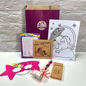 Unicorn party bag no plastic, including colouring sheet, crayons, seed pack, mask, party blower and A6 activity card